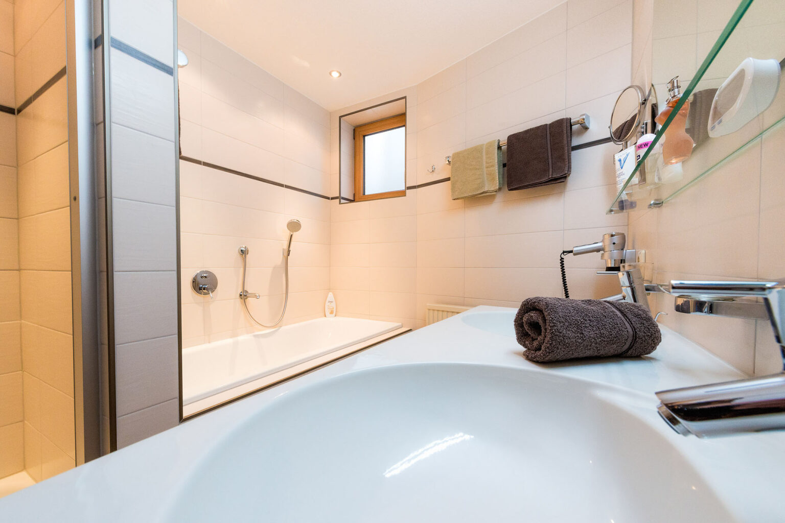 Bathroom with shower, bathtub, double washbasin